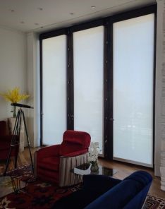 Elegant custom motorized roller shades in a Calabasas luxury living room, highlighting the perfect blend of technology and style.
