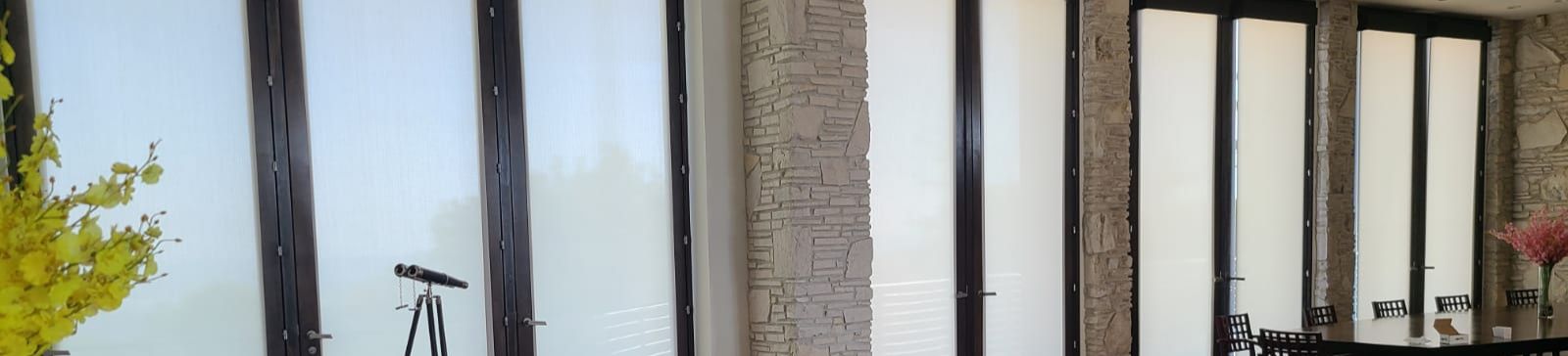 Close-up of Somfy automatic window blinds in a Calabasas home, showcasing seamless integration and elegant design.