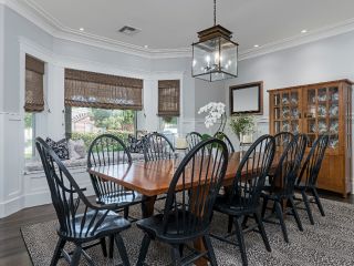 Woven Wood Blinds | Calabasas Blinds & Shades CA Enhance your kitchen with the rustic charm of woven wooden Roman shades, creating a cozy and inviting atmosphere.